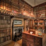 A historic library in Scotland featuring extensive wooden bookshelves filled with books.