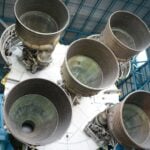 Close-up view of Saturn V rocket engines at Kennedy Space Center, highlighting intricate engineering.