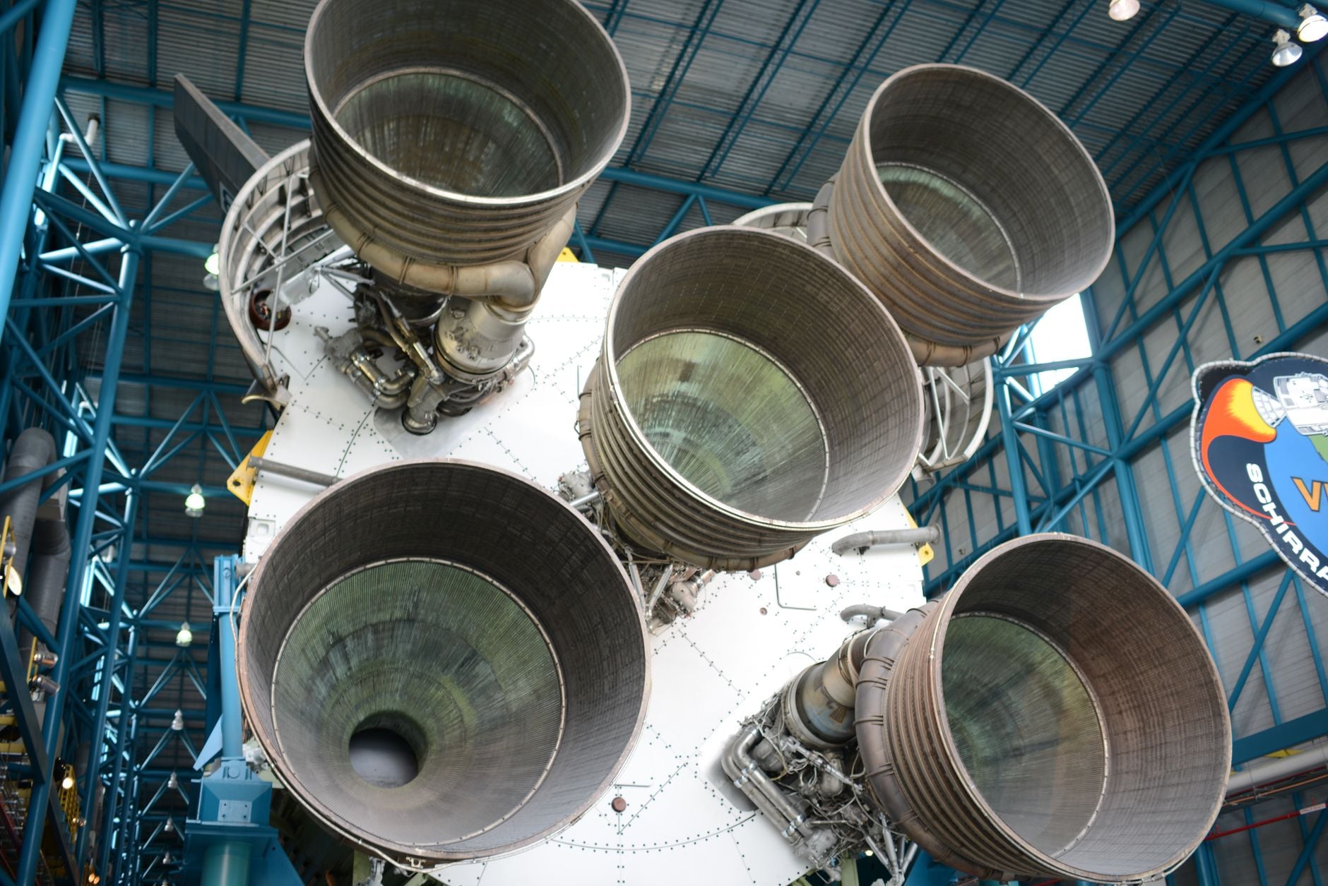 Close-up view of Saturn V rocket engines at Kennedy Space Center, highlighting intricate engineering.